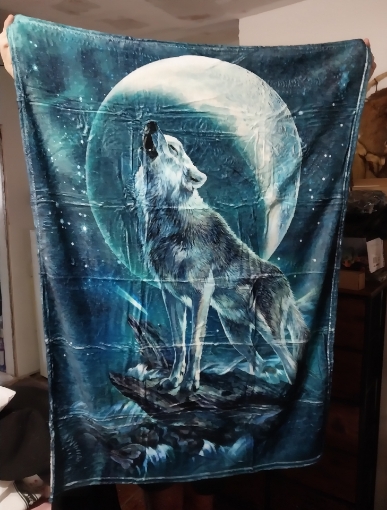 Picture of Wolf standing on rocks with moon | Fleece Blanket